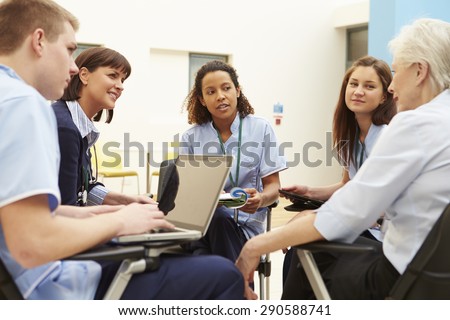Members Of Medical Staff In Meeting Together Royalty-Free Stock Photo #290588741