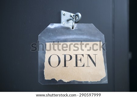 paper open sign at a store in  London