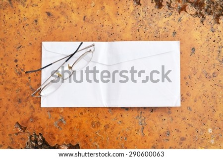 old invitation cards on wooden background