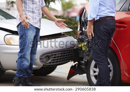 Two Drivers Arguing After Traffic Accident Royalty-Free Stock Photo #290605838