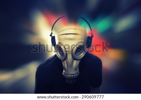 man with gas mask and headphones, grunge background,dj star party background,