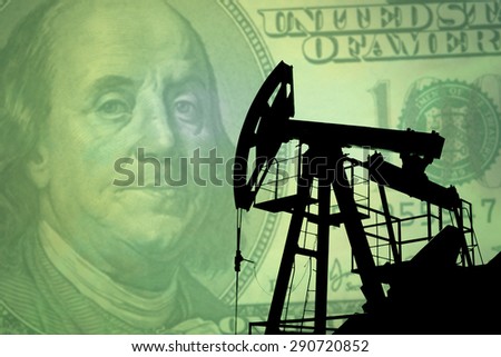 Oil pump on background of US dollar