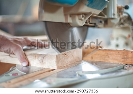 Circular Saw. Carpenter Using Circular Saw for wood Royalty-Free Stock Photo #290727356
