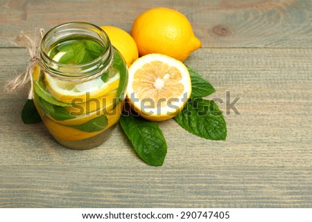  lemonade and glass on a wooden background