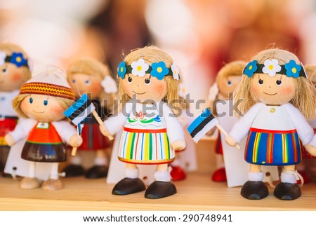 Colorful Estonian Wooden Dolls At The Market. Dolls Are The Most Popular Souvenirs From Tallinn And Symbol Of Country's Culture.