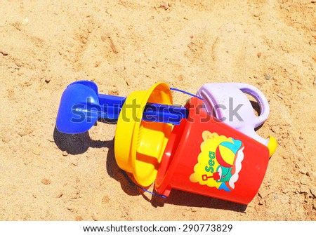 Children toys on the sand 