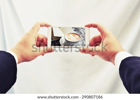 business man hand take a hot coffee photo