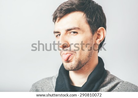 guy shows tongue