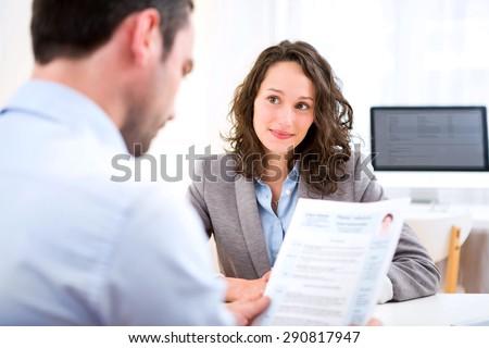 View of a Young attractive woman during job interview Royalty-Free Stock Photo #290817947