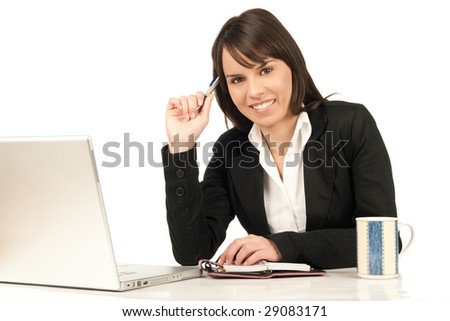 Happy business woman sitting at the desk