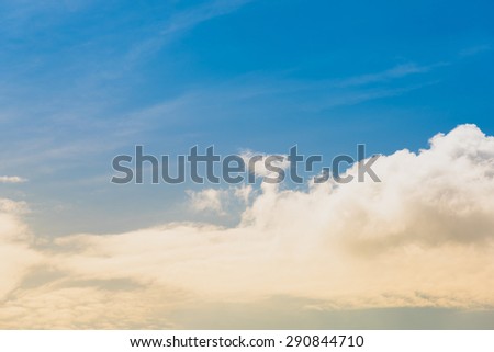 Clouds and purple sky as seen through window of an aircraft. Blue-sky with the sunlight. Blue-sky before night time with sunrise. Spectacular view of a sunset above the clouds from airplane. 