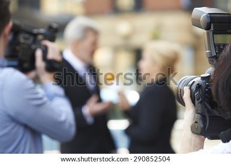 Photographer Taking Pictures Of Female Journalist Interviewing Businessman Royalty-Free Stock Photo #290852504