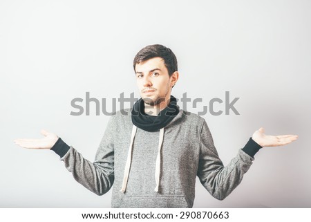 man throws up his hands