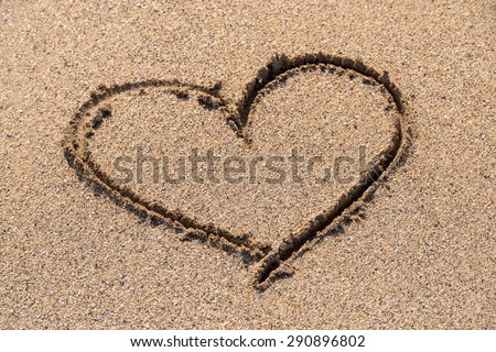 Heart Drawn On Ocean Beach Sand