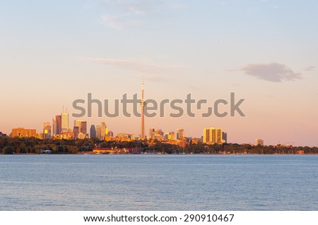Beautiful and colorful sunset over ontario lake in toronto, Canada, with skyline
