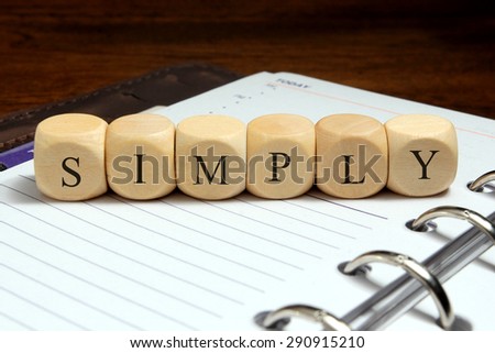 SIMPLY word written on wood block