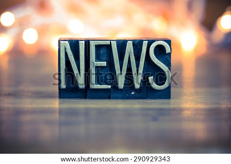 The word NEWS written in vintage metal letterpress type on a soft backlit background. Royalty-Free Stock Photo #290929343