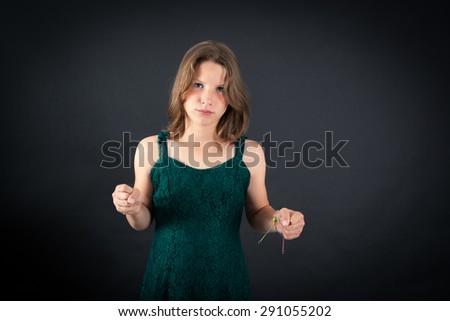 Beautiful girl doing different expressions in different sets of clothes: angry