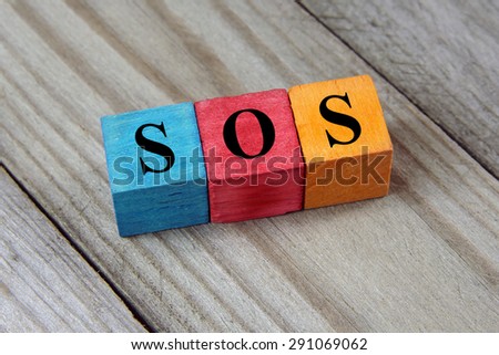 SOS symbol on colorful wooden cubes