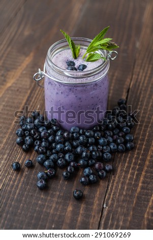 blueberry milkshake on a wooden desk