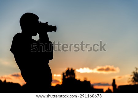 Silhouette of the photographer in beautiful sunset