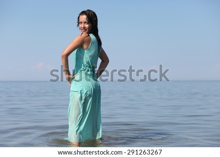 Beautiful young girl on sea