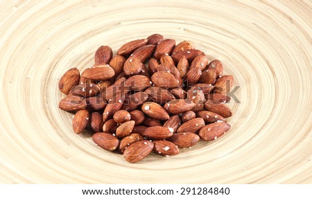 Salted Roasted Almonds Nuts on Wooden Surface/Roasted Almonds/Nuts