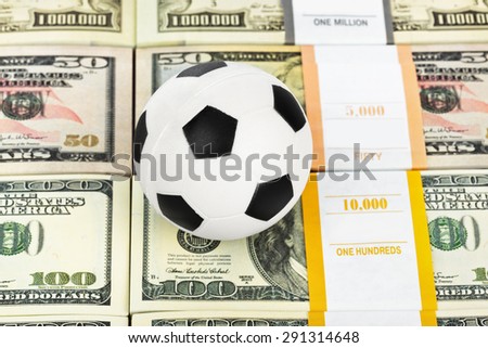 Money and soccer ball - sport and business background