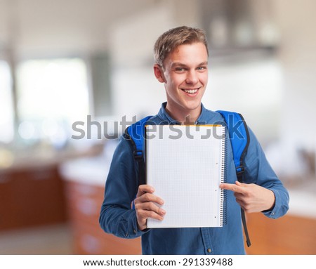 happy student man with a notebook