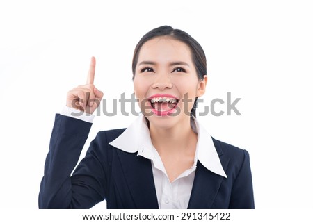 Thumbs up woman. Portrait of a vivacious laughing woman giving a thumbs up gesture of approval as she looks at camera, isolated on white background. Asian woman.