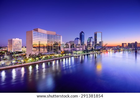 Jacksonville, Florida, USA city skyline on St. Johns River at dawn.
