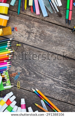 Items for children's creativity on a wooden background