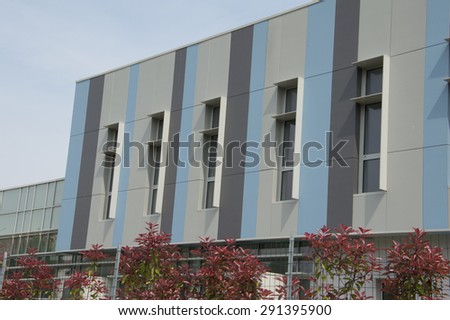 An exterior building, colored facade business structure