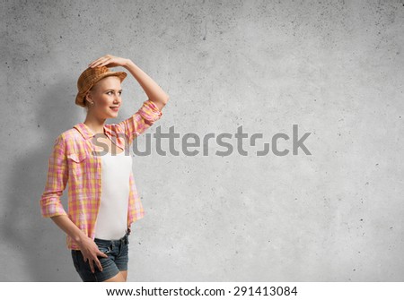 Pretty teenager girl in casual on cement background