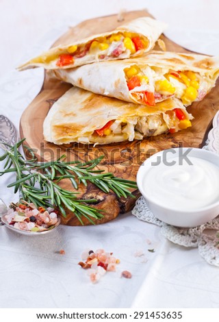 Mexican tortilla with meat stuffing, corn and vegetable salsa
