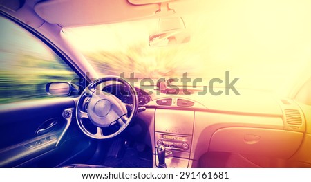 Vintage toned picture of a driving car interior, space for text.