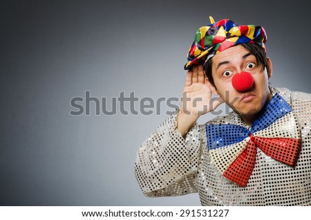 Funny clown against dark background
