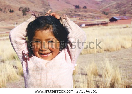 Aymara girl smiling Royalty-Free Stock Photo #291546365