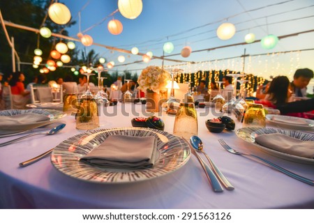 Table setting for an event party or wedding reception at the beach Royalty-Free Stock Photo #291563126