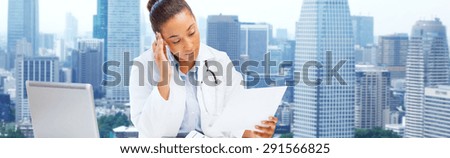 health care, medicine, people and technology concept - african american female doctor with laptop reading medical report paper over city background