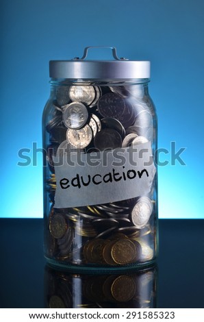 saving with purpose: jar full of coin for education