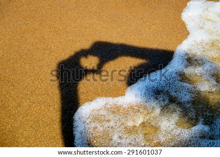 Heart Shape Shadow on the Summer Beach