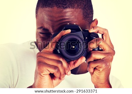 Young black man photographer doing photos