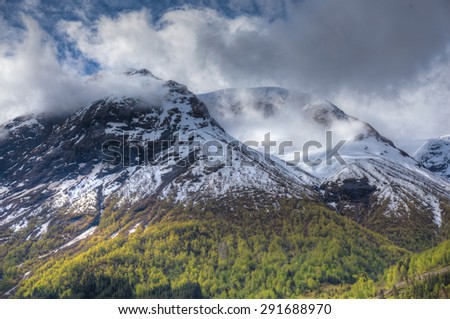 norwegian fjord with mountains and water