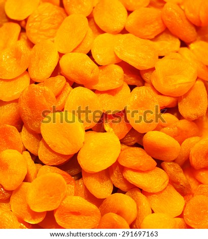 Heap of dried apricots background close-up. Food healthy backdrop
