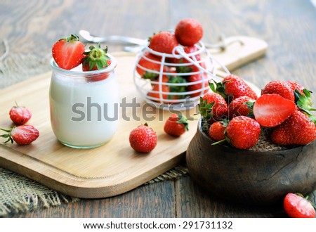 strawberries on a wooden table, country style