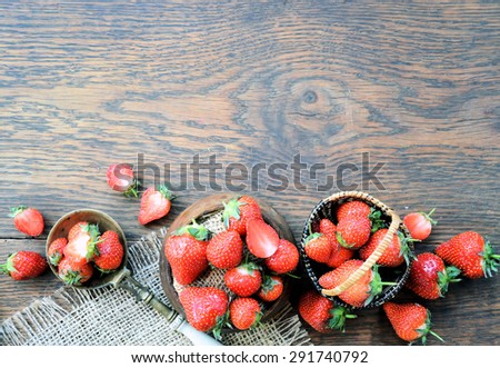 strawberries on a wooden table, background for text