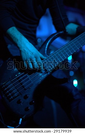 a man plays the electric guitar at a concert