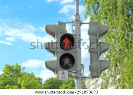 Blurred traffic lights turned on red