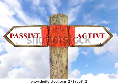 Passive versus Active messages - Wooden signpost with two opposite arrows on the blue sly background. Choice chance and change of lifestyle conceptual image